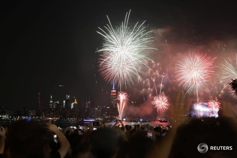 People watch fireworks at the East River State Park in Williamsburg, Brooklyn on Independence Day