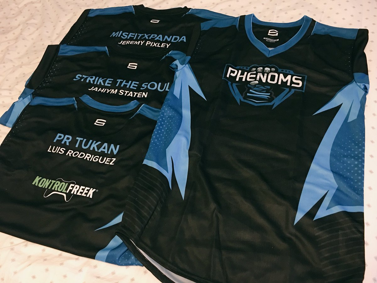 PhenomsPro's tweet photo. Jerseys for our #PhenomFGC boys are here! Huge thanks to @Sector_Six for the beautiful jerseys. Can’t wait to show these off at our next #FGC event!

Want some of your own Phenoms apparel? Check out our shop: 

https://t.co/w380A2bB16

#BePhenomenal x #ForTheEverydayGamer https://t.co/3uqRPVY3q1