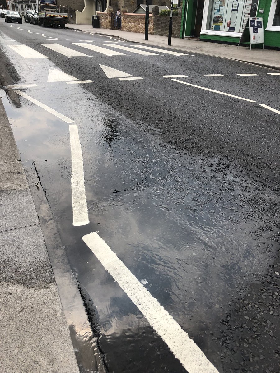 mrs_myrtle's tweet photo. @thameswater please can you come and fix burst water pipe on HAMPTON HILL high street. It’s been like this for 3 days now. https://t.co/qYIFvKtH7l