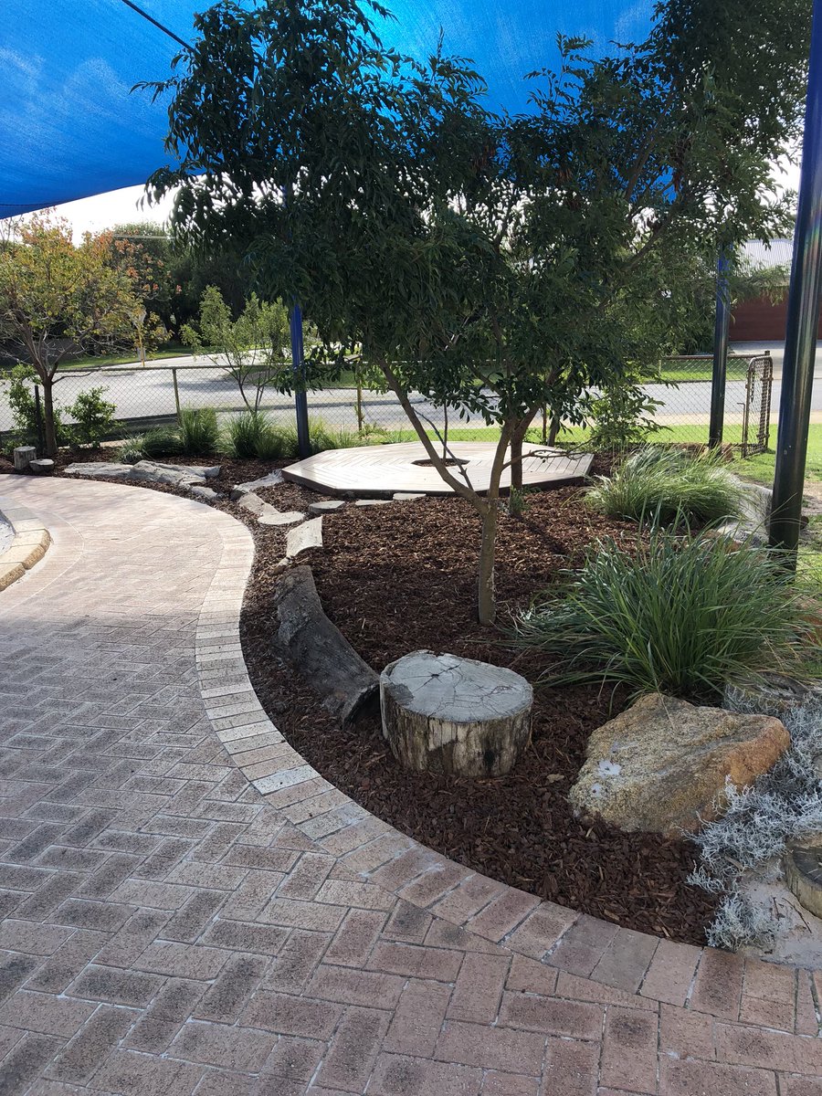 DaveMarshallHG's tweet photo. While the kids are away the ground men can play!! New soft fall and repairs for the Marian Campus these holidays. @NewmanCollegeWA #natureplay #playground #adventureplay #opportunities #surprise https://t.co/iBJAp9vSsE