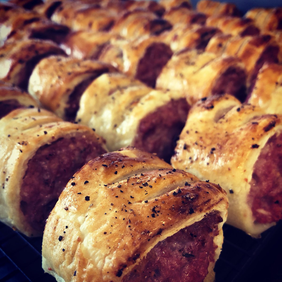 afternoontease's tweet photo. A small army of homemade sausage rolls ready for @CambridgePaus launch this weekend! Delicious sausage meat from a mile down the road #knibbs #local #homemade https://t.co/DQKrCuSXdh