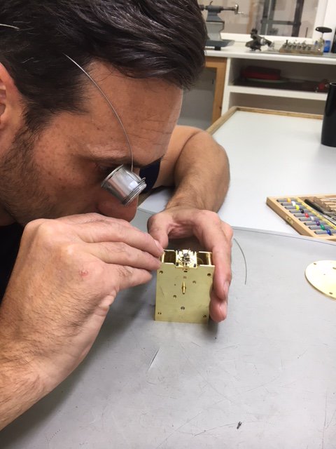 Here's our clockmaker inspecting the balance from a carriage clock movement which has been repaired by his apprentice #teamwork #learningnewskills #clockrepairs #carriageclock #clockrestoration #norwichbusiness #norfolkbusiness