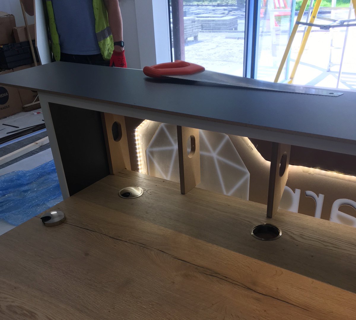 We've been on site at the for @Bbi_Group installing our illuminated reception desk 💡💫
Using our #CNC capabilities to integrate the client's logo, we crafted the desk using @coriandesign 'Designer White' and @EGGER_UK 'Natural Halifax' Oak. 

#reception #bespokeinterior