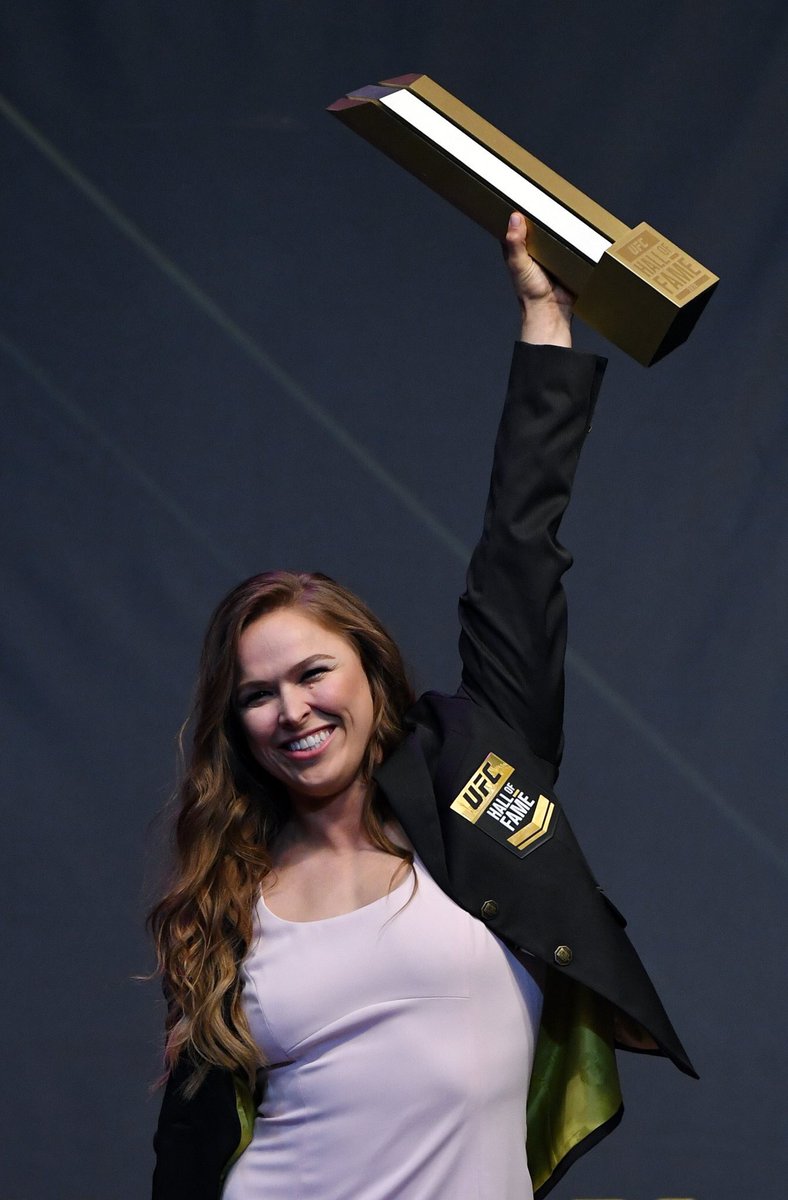 PWStream's tweet image. LEGACY: Record-breaker Ronda Rousey enters the #UFCHOF. Not only is she the the first woman to enter the UFC HOF, but she’s also the youngest, at 31.