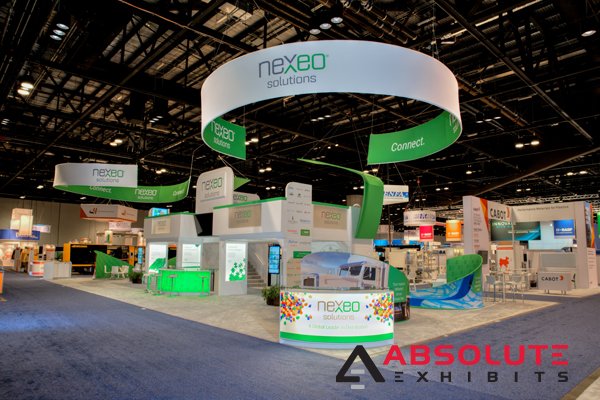 absolutexhibits's tweet photo. #FBF to producing @nexeosolutions's #tradeshow #booth at #NPE with tensioned-fabric hanging signs, frosted-glass counters, lightbox graphics, and double deck #tradeshowdisplay #marketing #branding #exhibitdesigners #convention #plastics #designers #design #exhibiting #displays https://t.co/If38fu0ibT
