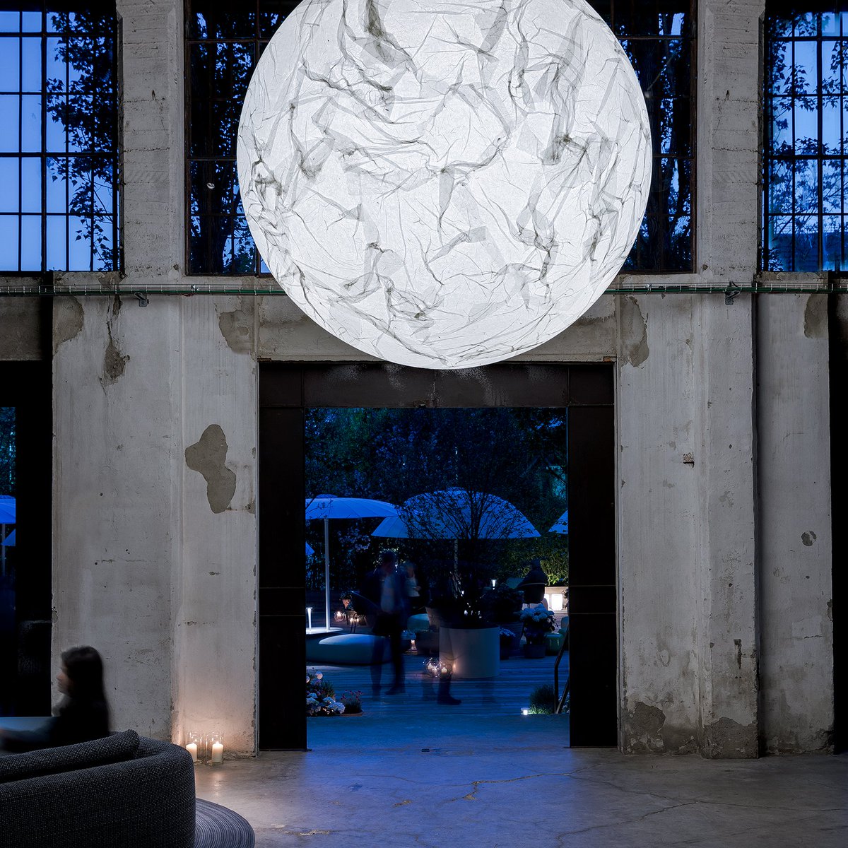 Summer in Milan … MOON 200 special version. 
It’s magic and like all good magic, it works every time.
The Japanese paper used on the outside is made by hand, so every lamp is unique and different.
© Davide Groppi srl, ph. Fausto Mazza