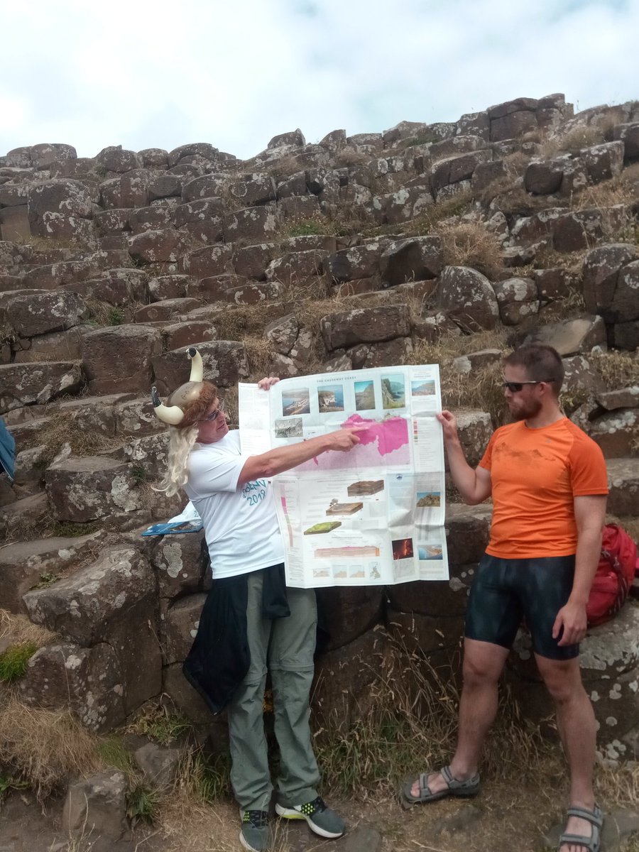 geoENV2018's tweet photo. At the Giants Causeway.  Lava flows, columnar basalts and weathered paleosoils. #geoENV2018 #FieldtripFriday @GCausewayNT @CooperGeoNI @mckinley_geojen @drsamroberson @GeoConor  Al Ruffell @QUBelfast @GeoSurveyNI @GeolSurvIE https://t.co/gOOAYT0E43
