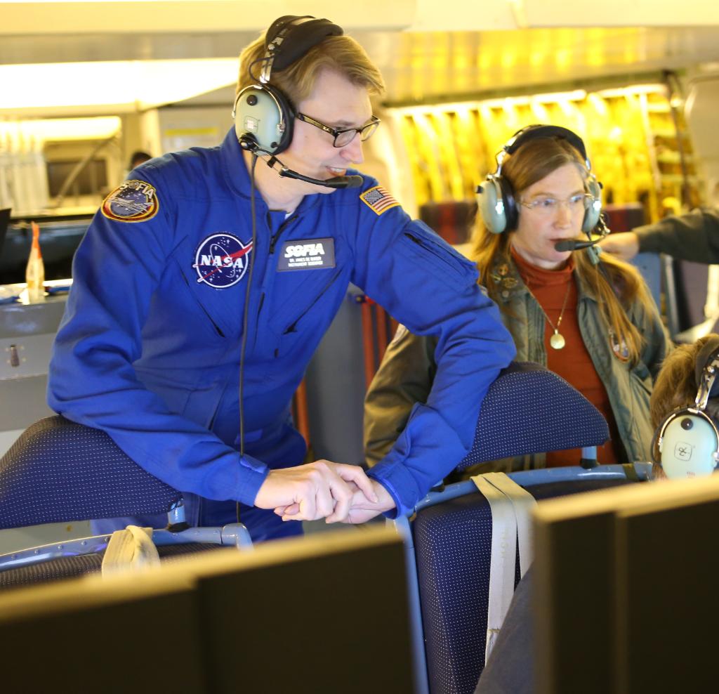 James De Buizer, the science planning and instrument support manager for SOFIA onboard an observing flight. This image is the cover art for a NASA in Silicon Valley Podcast feature De Buizer.