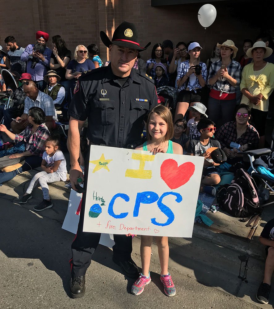 CalgaryPolice's tweet image. When you want to show your support for the police with an awesome sign &amp;amp; your parents tell you "You should add @CGYFireFighters too" but it's a little too late.

Spotted along the #StampedeParade route this morning.