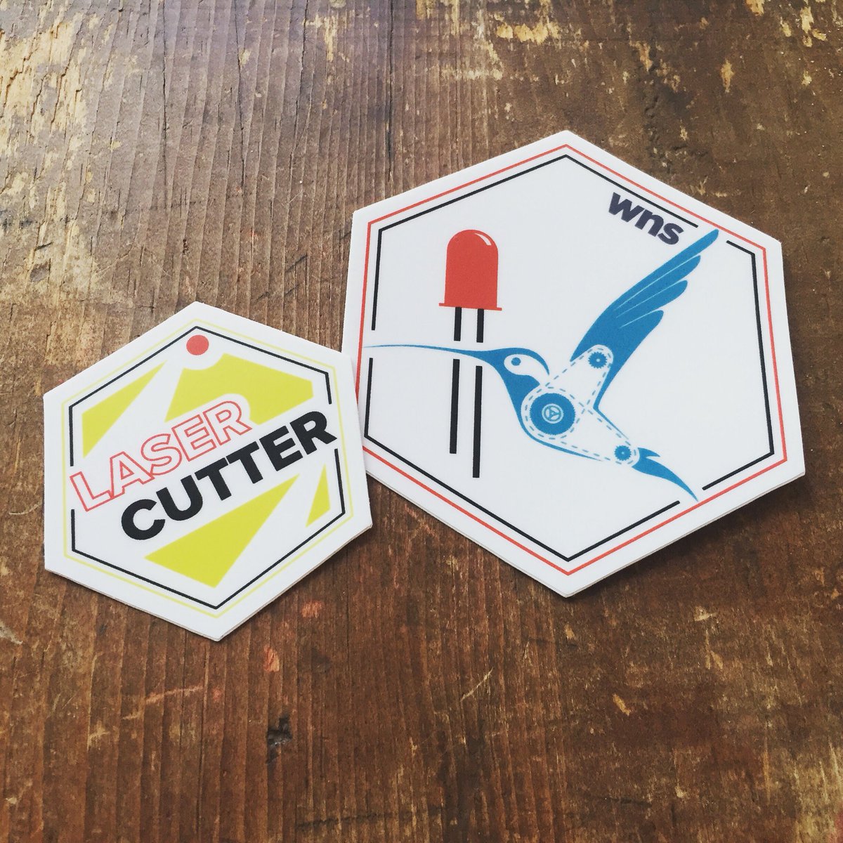 jumekubo's tweet photo. Testing out some designs for our skills badges at Westside Neighborhood School, using @stickermule. #illustrator #graphicdesign #logos #makered #hummingbirdrobotics @wnsjets @birdbraintech #lasercutting https://t.co/CAR6G1dT1h