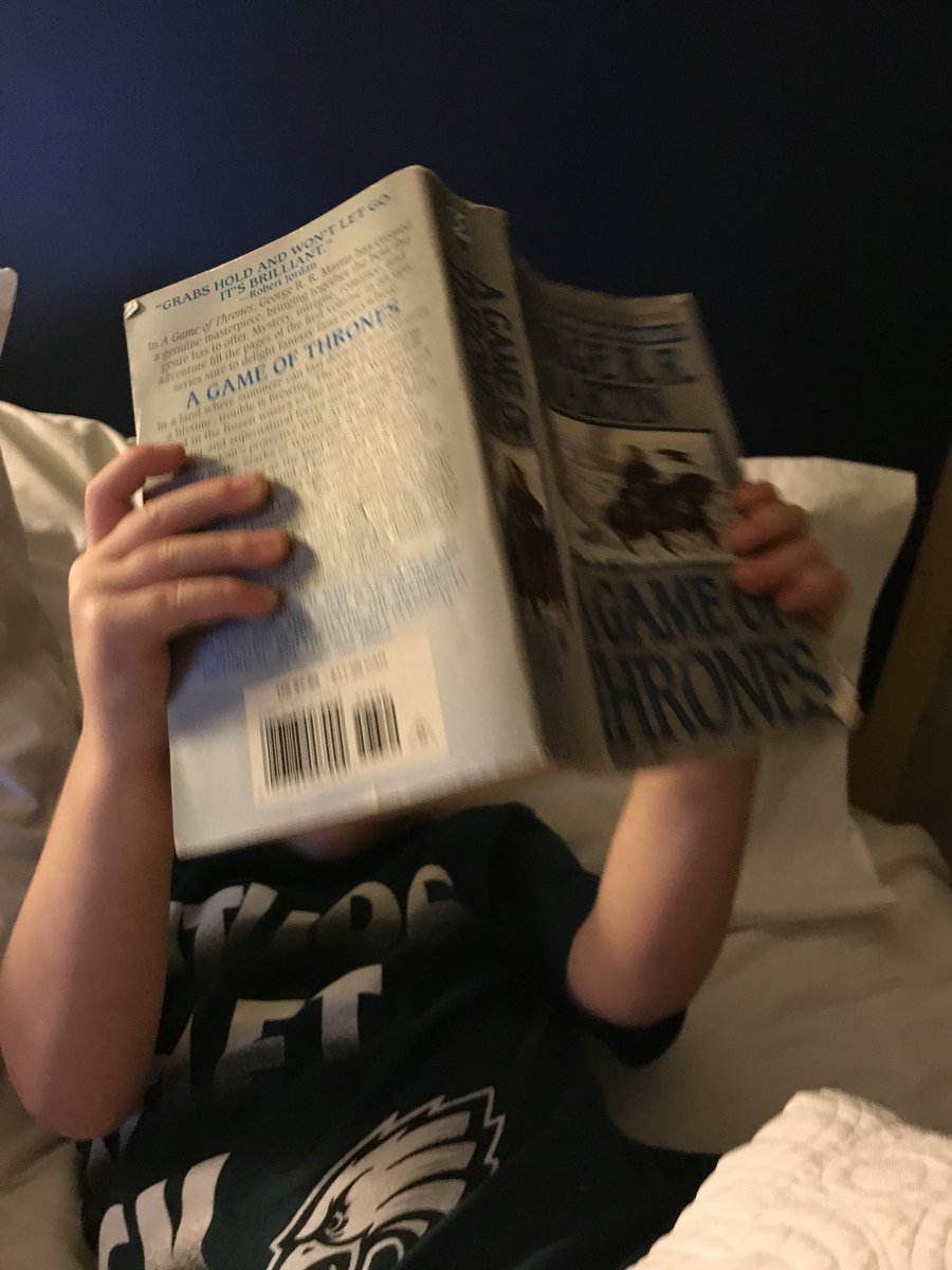 phillyfan1024's tweet photo. He took his dads #Gameofthronesbook #somelightreading #tryingtocatchup #ginger #GoT #cuteness https://t.co/Z1INWHJHzm