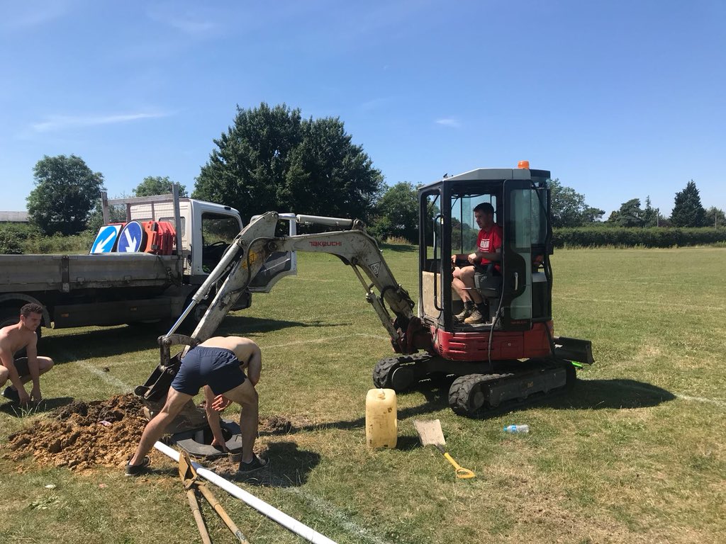 GaaNicks's tweet photo. Hard graft in 30 degree heat putting in the new posts at St Mary’s the home of #GAA  in #Bristol. Thanks to Sponsor Paddy Miskella for the machinery &amp; hard work &amp; the lads for their efforts too. #Nicksabu #BristolGAA #newpostslookingwell @BPCGAA @Gloucestershir3 https://t.co/WWXv22PQ2l