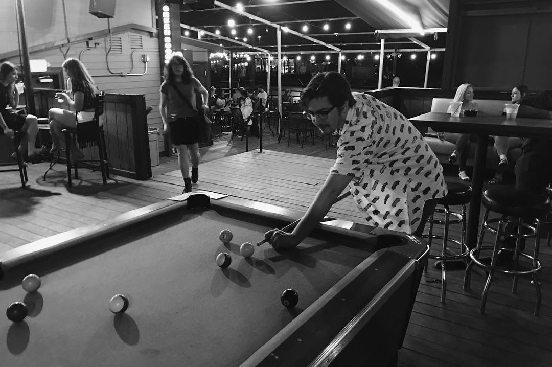 Stop by for a game of #pool on the #rooftop patio! We have fans up there as well as 2 bars serving. Try #bargames like #jenga &amp; grab a bite to eat. To see our menu, learn more here: dallasgreenroom.com/our-menu/ #Dallas #Bar #Patio #DFW #Drinks #AmericanFood #RooftopPatio #DeepEllum