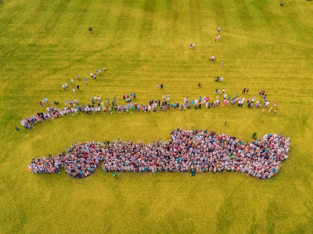 MercedesAMGF1's tweet photo. What a way to celebrate Family Day! 😊

Brackley and Brixworth coming together to watch Lewis take his sixth #BritishGP pole! Magic... 

📸 Family photo! 

#DrivenByEachOther 👊 https://t.co/mTuAthTvOH