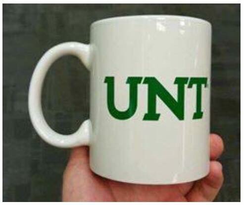 Coffee mug that spell c*** using the mug's C-shaped handle as the first letter of the word.