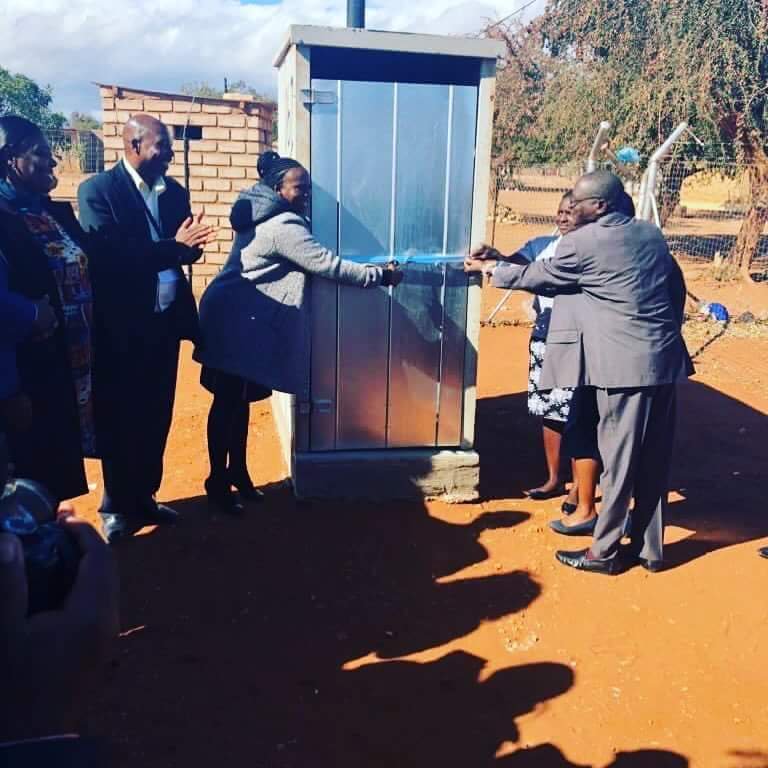 AN7Reporter's tweet photo. Meanwhile, in South Africa, politicians arrange a ribbon cutting...

... for a toilet, one toilet and it's not even inside a house.

We are lead. https://t.co/agjBnH4POn