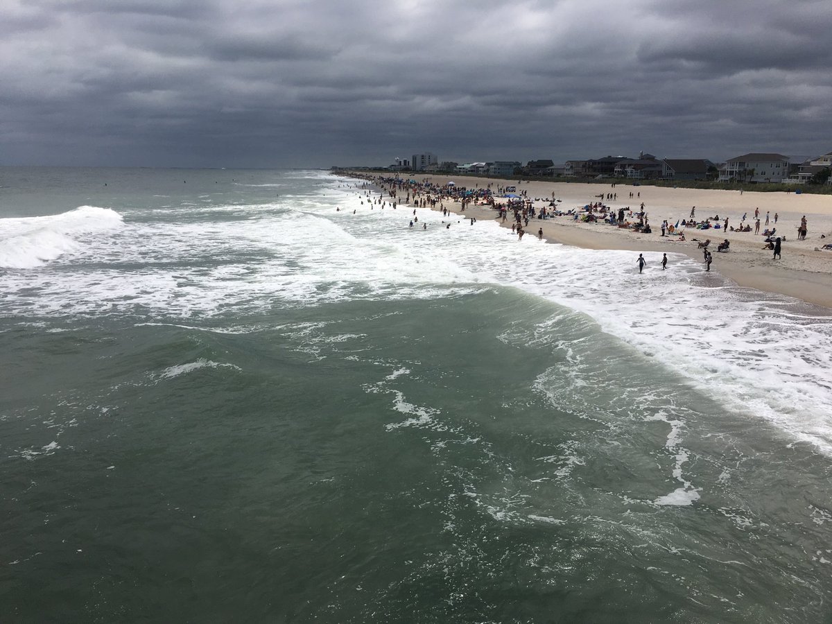 Sun came out suddenly #wrightsville #beach #johnniemercerpier Pier. You can tell #TropicalStormChris is our there. #redflagwarning #riptide #lifeguards working over time