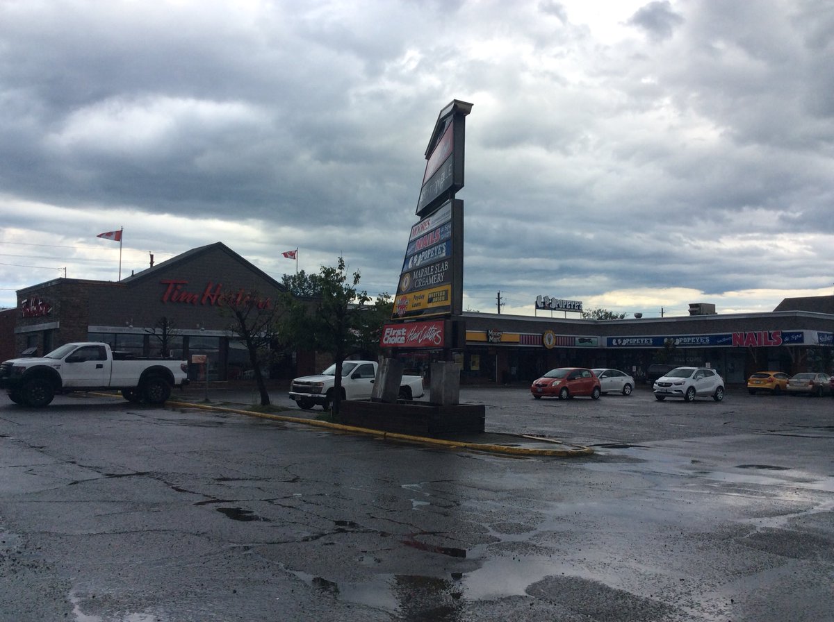 GuyChamberland's tweet photo. This mall sign on Lasalle at Barrydowne got twisted by the wind’s force. #sudbury @CBCSudbury @TimHortons https://t.co/TJrtNnkgLK