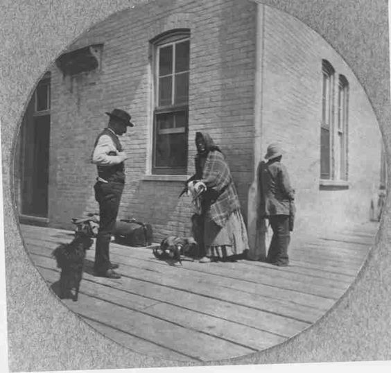 'Woman selling Bison horns at the train station, Saskatoon, 1909.'[SAIN]