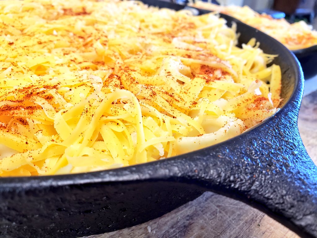 Super decadent cheese sauce and mac(pasta) are finally together in holy matrimony ... layered em out in two black cast iron pans and we're about to go into the oven!
#ZeroShame !!