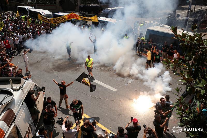 Taxi drivers in Barcelona stage a 24-hour strike against what they say is unfair competition from ride-hailing and car-sharing services such as Uber and Cabify