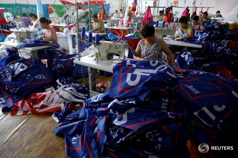 Workers make flags for U.S. President Donald Trump's "Keep America Great!" 2020 re-election campaign at Jiahao flag factory in Fuyang, Anhui province, China