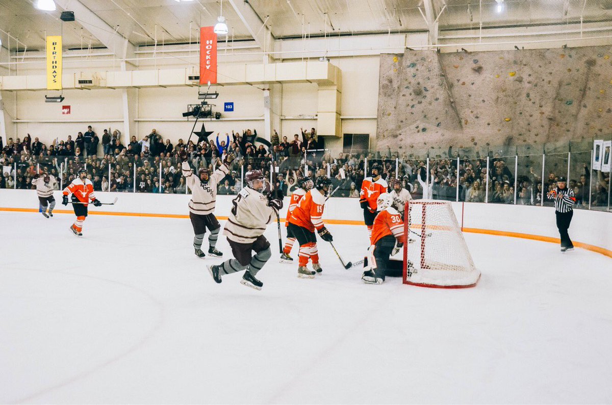 aggie hockey team celebrating after scoring a goal