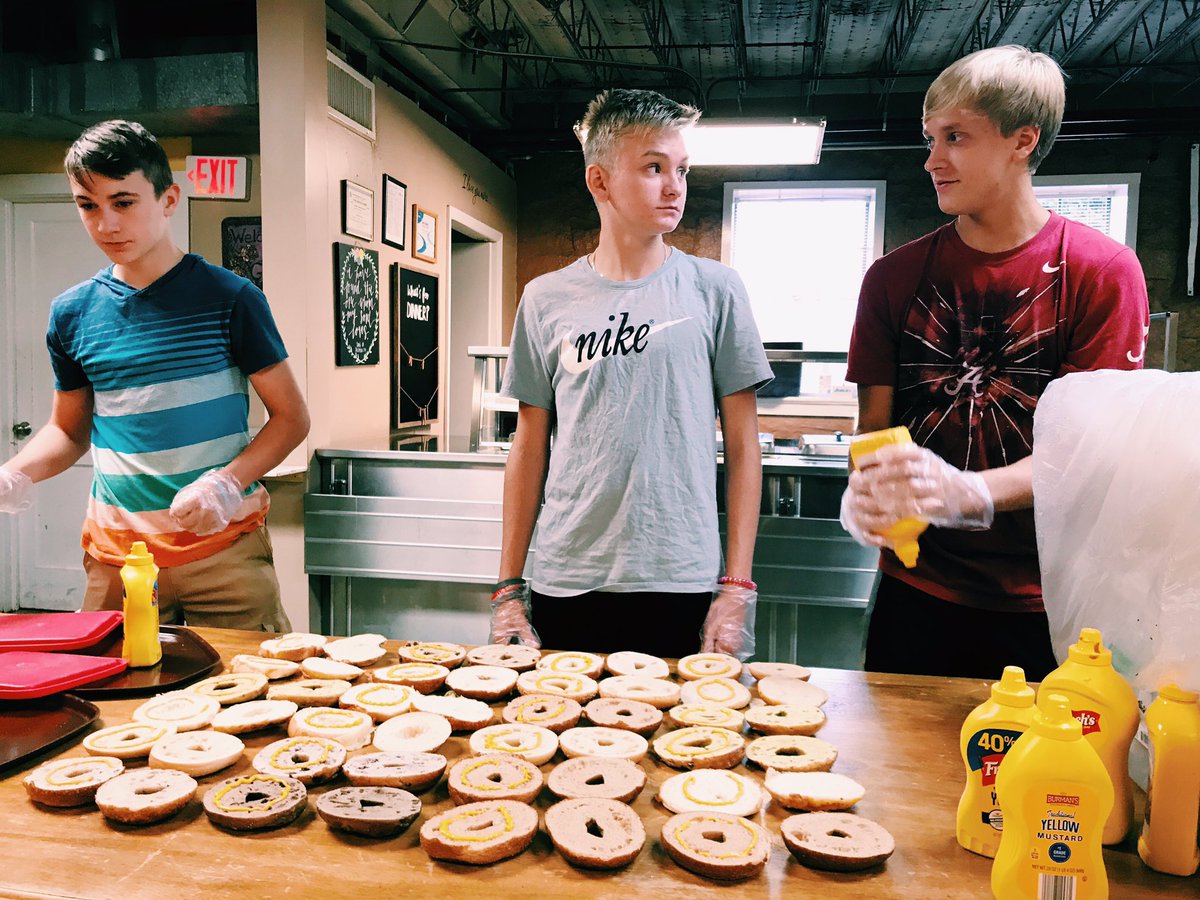 M25CampATL's tweet photo. "We're making how many lunches??" Our group from Collinsville, Alabama is serving with M25 for the first time this week and spending the morning on the bridge route with the 7 Bridges Crew! Any advice for our first-timers?#workhardwork https://t.co/cN2kwWKCk7