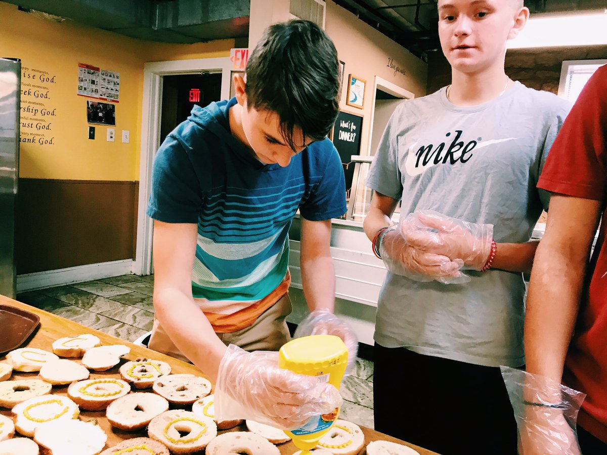 M25CampATL's tweet photo. "We're making how many lunches??" Our group from Collinsville, Alabama is serving with M25 for the first time this week and spending the morning on the bridge route with the 7 Bridges Crew! Any advice for our first-timers?#workhardwork https://t.co/cN2kwWKCk7