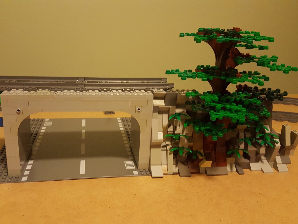 Darrick_Becken's tweet photo. Working on our Lego train bridge, rock wall and tree. #LEGOcity https://t.co/kwvoplxduF