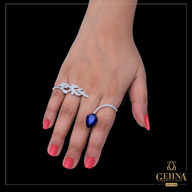 GehnaJewellers1's tweet photo. A delicately-crafted #PalmCuff with #Diamonds and #Sapphire that oozes elegance. https://t.co/lXIIFLKPEz
