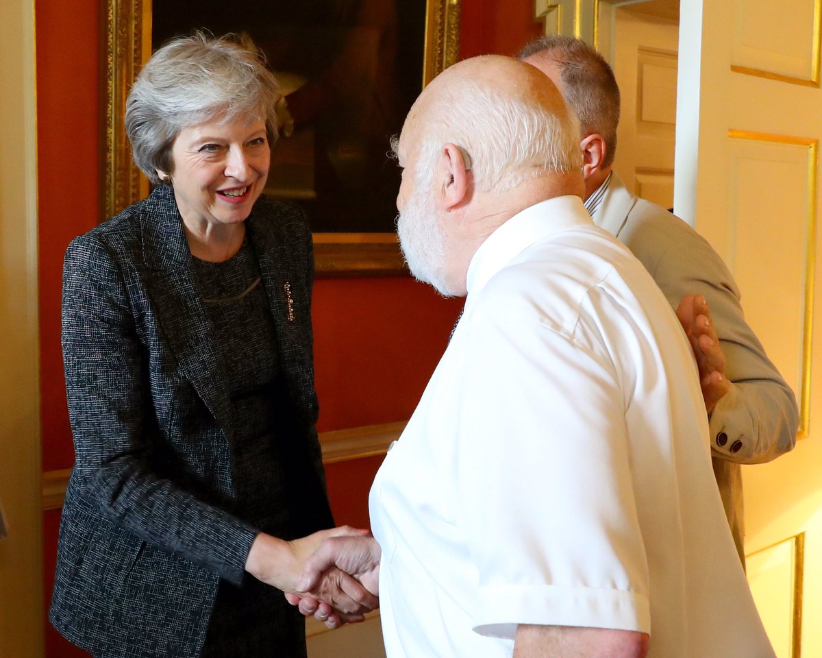 theresa_may's tweet photo. It was an honour to welcome to Downing Street the British cave divers who helped rescue 12 boys and their coach in Thailand. In incredibly dangerous circumstances, they acted selflessly - on behalf of the whole country, thank you. https://t.co/7VFHDb1bXf