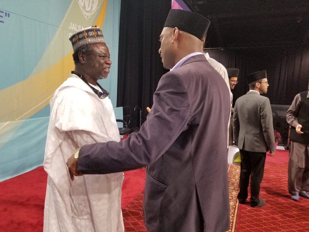 PAAMA_UK's tweet photo. Abdul Ghani Omokanye Sahib affectionately meeting Presidents of #PAAMA_UK and #PAAMA_USA at #JalsaCanada. How little did any of them know that he was soon to join the brotherhood of #PAAMA Presidents worldwide as the first President of #PAAMA_Canada. https://t.co/4TzLJbeLDF