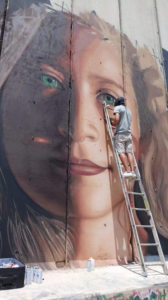 saidshouib's tweet photo. An Italian artist draws the picture of #Ahed_Tamimi on the Israeli separation wall in Bethlehem city. Ahed is gonna be free on Sunday as her father said. https://t.co/hCeRz4uAZC