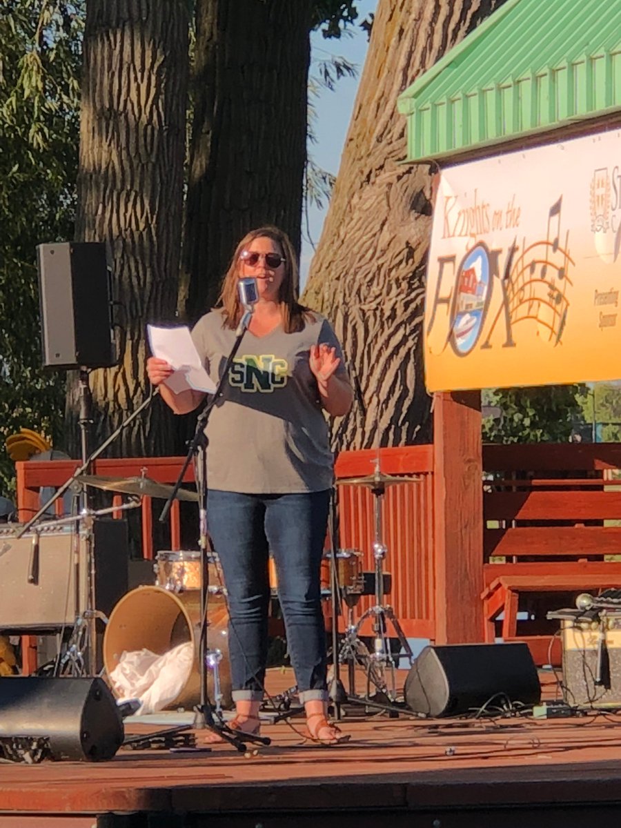 In her new role as VP of the @stnorbert Alumni Board, our @SonnentagRachel '06 served as emcee of the college's Knights on the Fox concert Tuesday. Rachel introduced FEATherWOLF to a cheerful crowd on a beautiful night. #MasterOfCeremonies #OnStage #WhatANight #SNC #TeamOCC