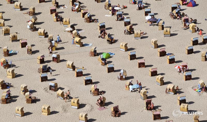 People enjoy the beach on the Baltic Sea in Travemuende, Germany