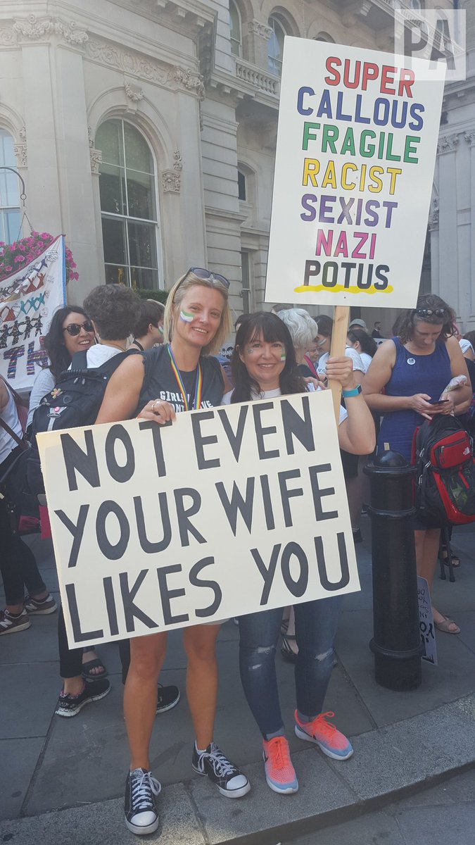 PAHelen2's tweet photo. Trump protest march in London. Definitely not fans of Trump.
Lucy Guy, 41, with  "Not even your wife likes you" poster, and Emily Darnell, 40, of Haywards Heath. https://t.co/kacQQ43h5r