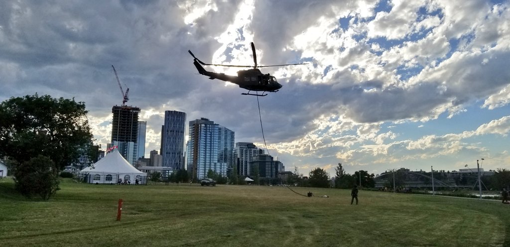 elrednaxela's tweet photo. #cpacow watching the Canadian Forces helicopter take off at @fortcalgary to lift a Canada Flag over the @calgarystampede grandstand! @CalgaryParking #yyc https://t.co/j4jQwqogPi