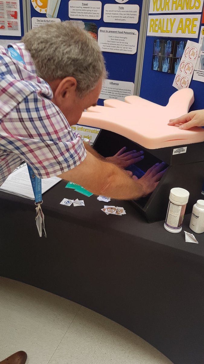 IPCTeamNWAFT's tweet photo. The Infection Control Team are at the Hinchingbrooke open day! Testing how clean peoples hands are, including the chief executive! https://t.co/VJnRMTRLqp