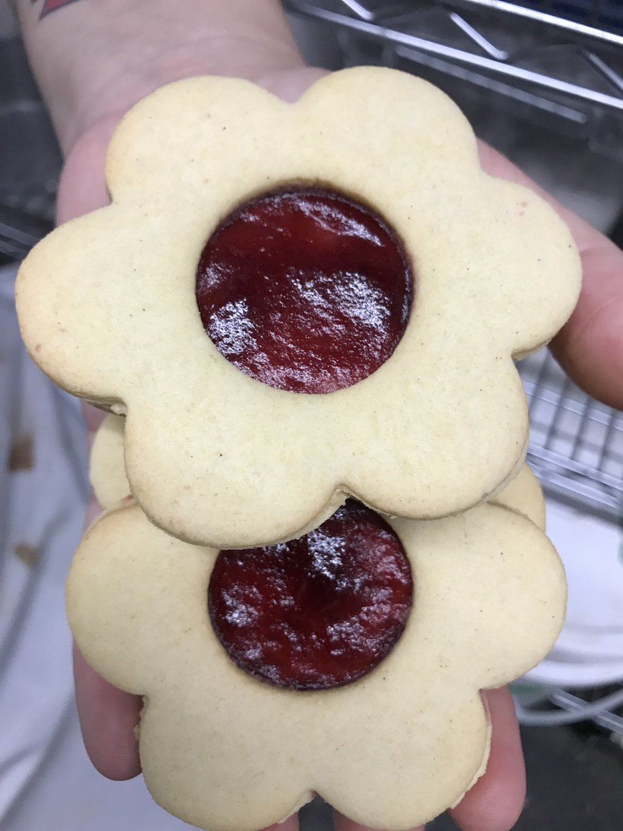 Jam jam cookies. A little different than the ones my grandma made - but just as tasty. A sugar cookie filled with locally made seedless raspberry jam. #vegan #glutenfreevegan #dairyfree #raspberry #jamjam #cookie #summer #tasty #mmmm #manitobamaid #sugarcookie #sandwichcookie