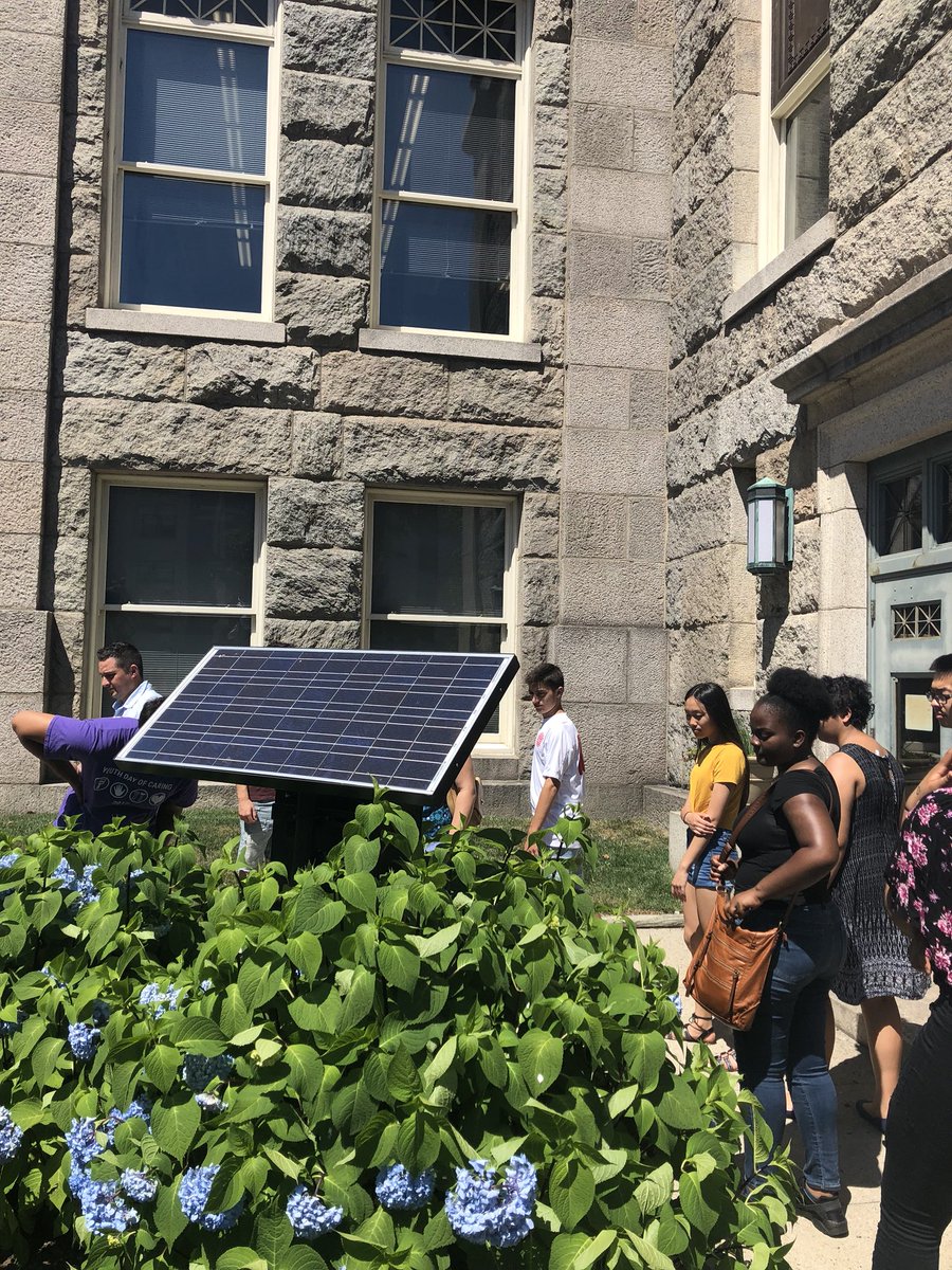 SC_Energy_Chall's tweet photo. The students interning for the Marion Institute, visited the New Bedford Public Library and discovered a solar panel &amp; some info regarding it! We the students will be at the farmer’s market and walking around the city to convince individuals to buy solar panels! #savetheplanet https://t.co/72q2lOZxYf