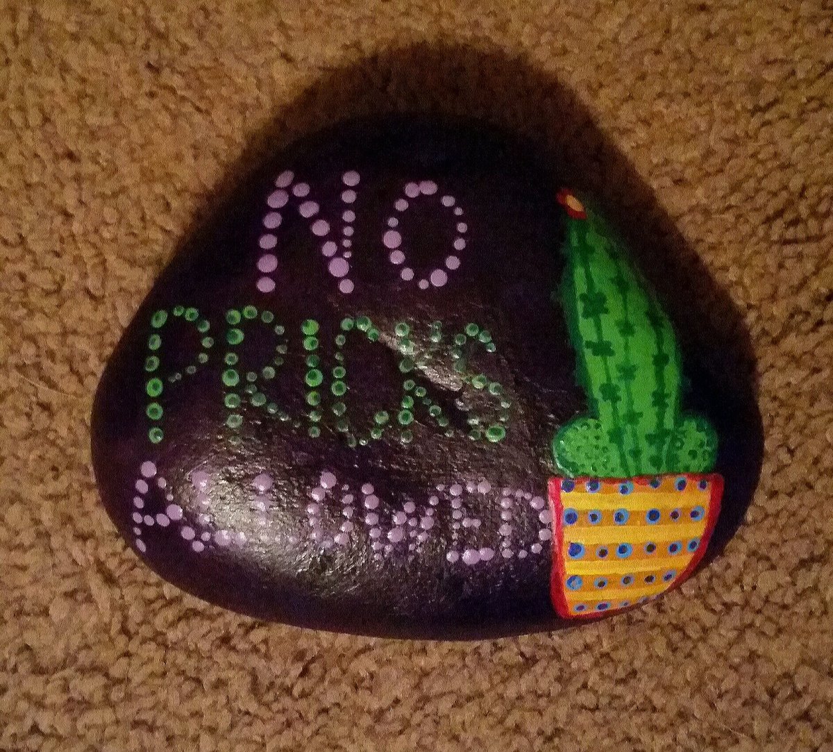 QuirkyMeg's tweet photo. Made this rock for a friend, but I think most can appreciate the sentiment. And I swear it looks better in person. #NoPricks #BeKind #PaintedRocks #QuirkyCrafts #BetterInPerson #Cactus #PunsAreFun https://t.co/7E7LKTa9Ot