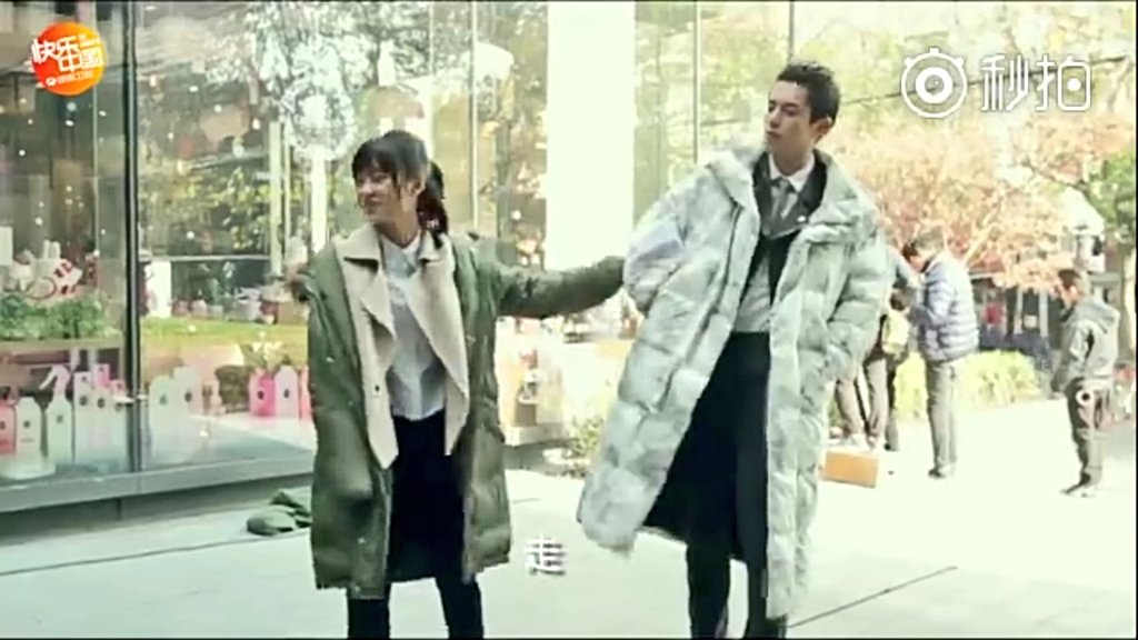 (9) Yy's grabbing Dd's arm they should start going but he was so lazy here  and she teased him saying " Your legs is very long but you walk so slowly! "  our Yue is so cute pulling Mr. Dd long legs 