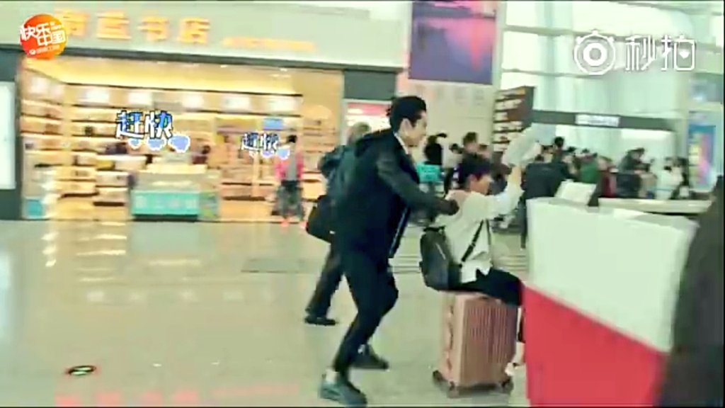 (10) so far this is my fav. part in the bts vid.  Yy was about to slap Dd here and she goes back quickly but Dd ask her to push the luggage wheel while he is sitting there and they switch places Just look at the 3rd pic where all the attention of the staff's are on them 