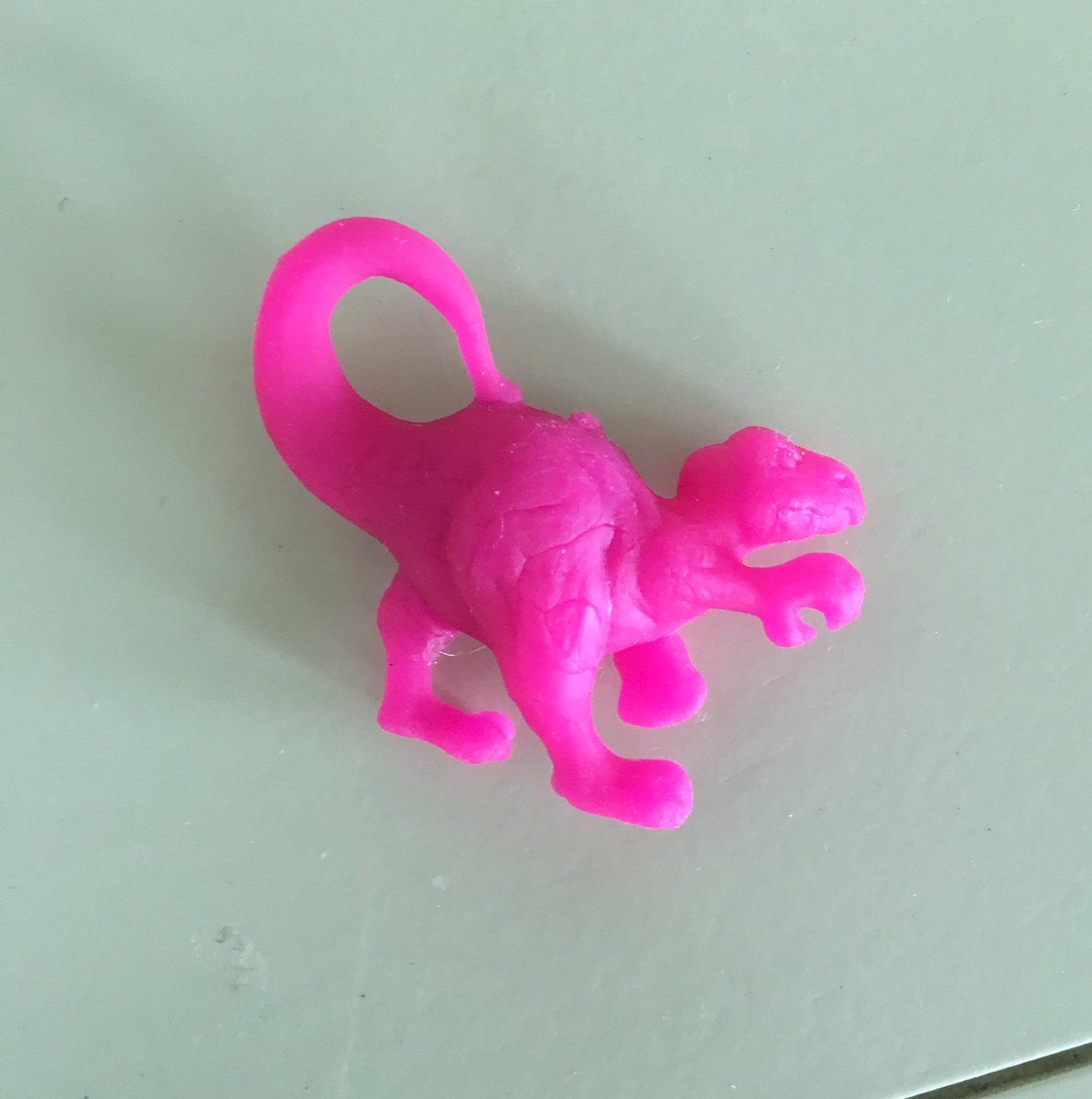 tiny rubber dinosaurs
