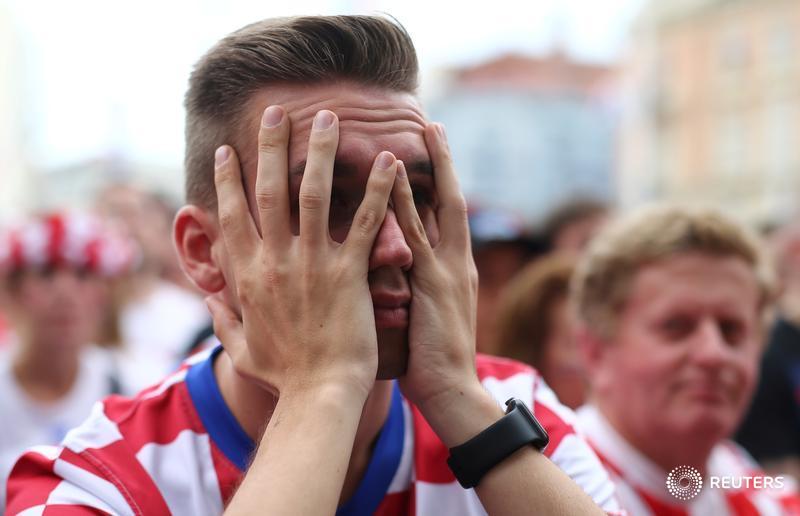 Reuters's tweet photo. Croatia's fans react during #WorldCupFinal match at Zagreb's main square https://t.co/cjDiQRweaE For more: https://t.co/fXUf2b06vZ https://t.co/c4iu1wZqIj