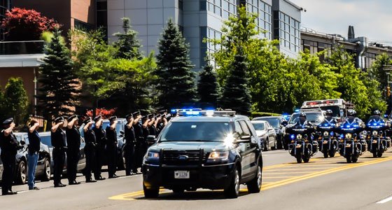 wbznewsradio's tweet photo. It was a somber ritual outside as officer Michael Chesna’s body is escorted from South Shore Hospital. @Karynregal reports 
https://t.co/1KaB7yy1MY https://t.co/uslz7we7se