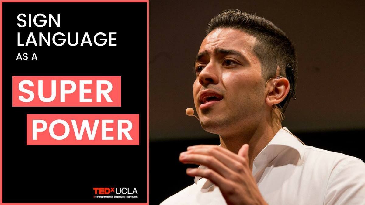 Austin Viday speaking at the TedXUCLA event. He wears a white collared shirt. You can see his black cochlear implant above his left ear. Text says: Sign Language is a Super Power. 