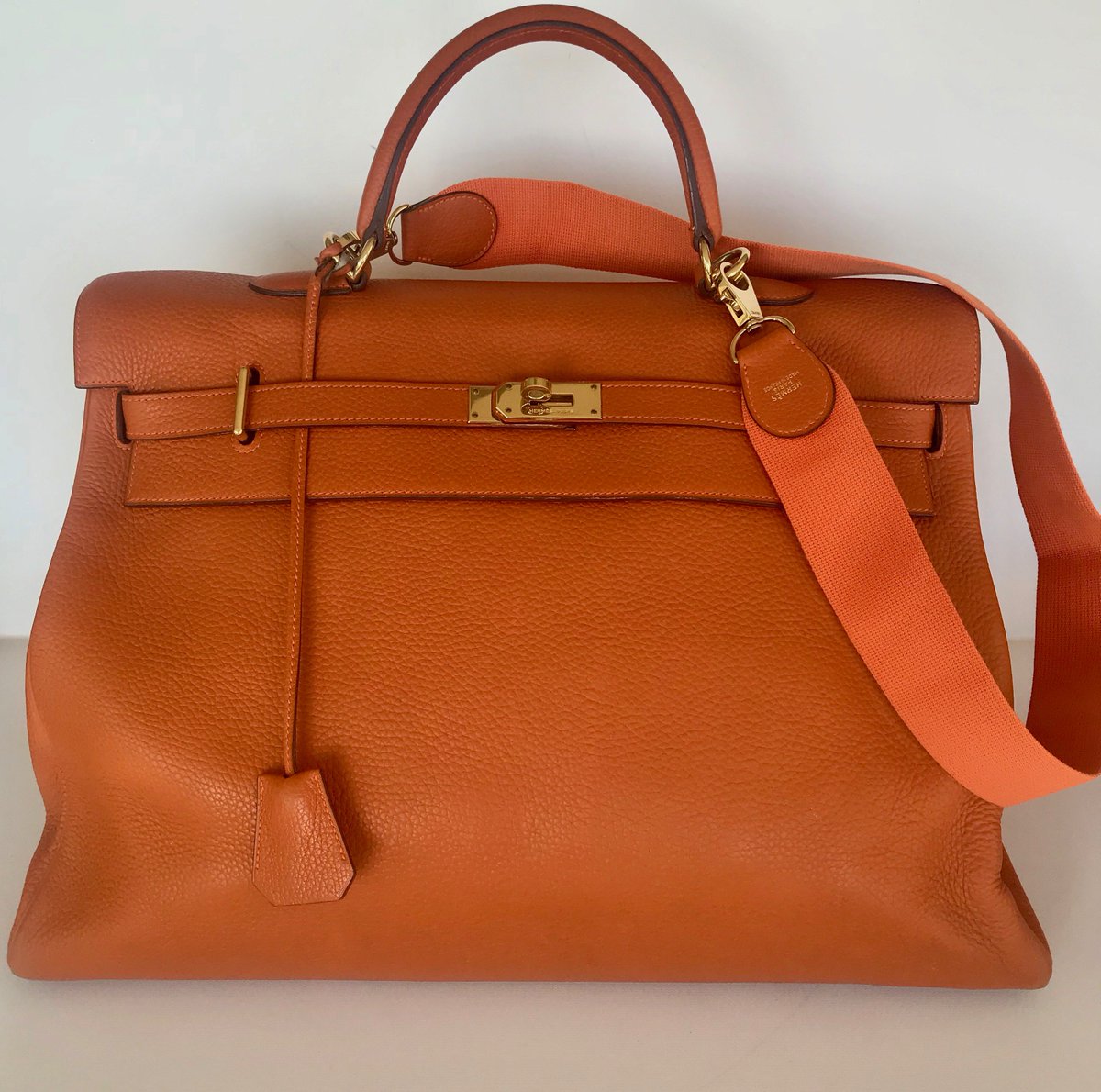 Couture Studio Online on X: HERMES KELLY 50 CM ORANGE CLEMENCE LEATHER  TRAVEL BAG WITH SHOULDER STRAP, only used a few times and in wonderful  condition.  See link to my store