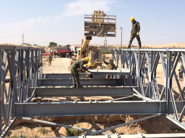 CSOJTF_Central's tweet photo. @SOJTFOIR trained the 1st class of the #SDF Engineer Support Unit. For their final exercise, students built a bridge near Jurnia, #Syria. They can now build and maintain bridges on their own, facilitating travel for the community and promoting commerce. #AfterDeash @SDF_MOACC https://t.co/CF9mrH8dcx